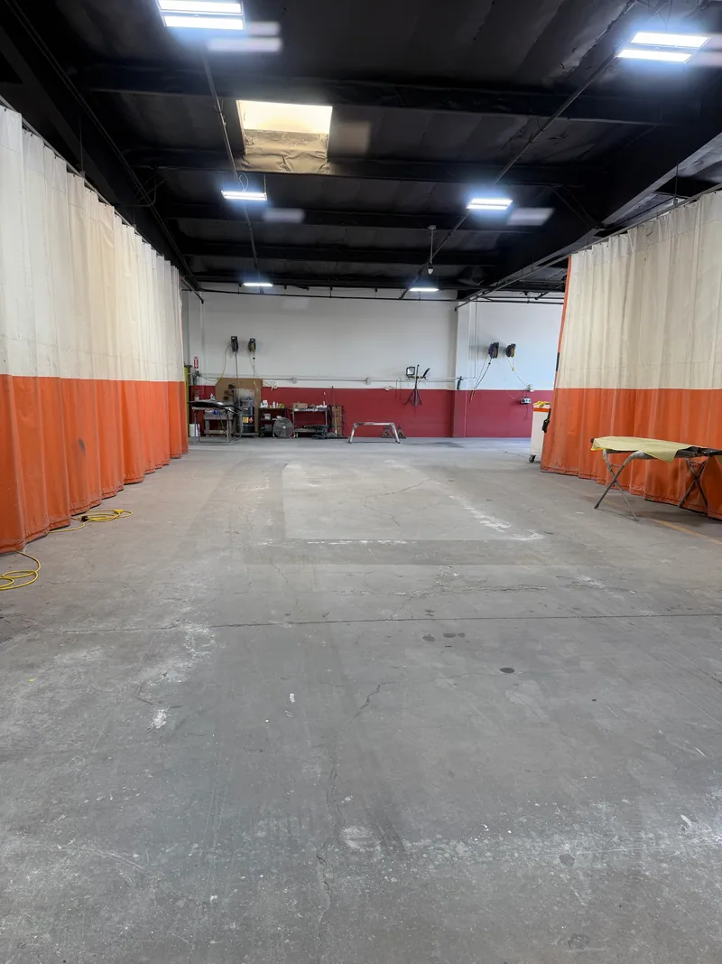 Curtained work area inside the Orange Coast workshop